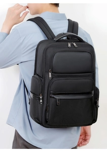 Side view of high-density business backpack with multi-layer pockets on male model