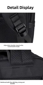Detail of adjustable shoulder strap with plastic buckle and reinforced stitching on backpack