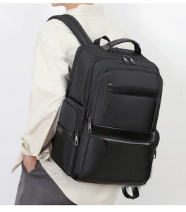 Side view of black business laptop backpack with multiple zipper compartments