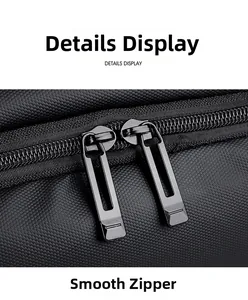 Detail of durable dual metal zippers and honeycomb textured fabric on black backpack