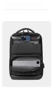 Macro detail of multi-layer pockets with USB charging port for business backpack
