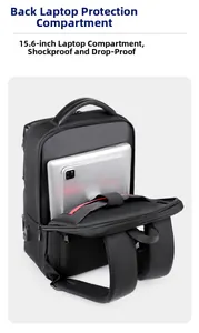 Detail of 15.6-inch padded laptop compartment and USB port on black travel backpack
