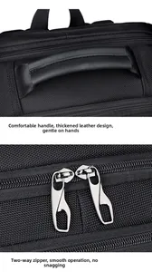 Detail view of thickened leather handle and durable metal zippers on black laptop backpack