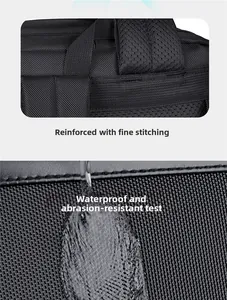 Detail of waterproof oxford fabric with water drops and reinforced stitching on backpack