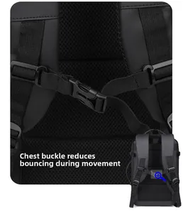 Detail of adjustable chest buckle and breathable mesh shoulder straps on black backpack