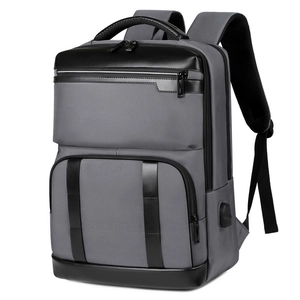 Men's expandable travel backpack in grey and black with a built-in USB charging port
