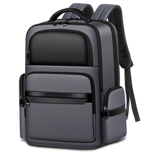 Grey business laptop backpack with leather trim and multiple compartments on white background