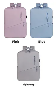 Waterproof laptop backpacks in pink, blue, and light grey with USB charging ports