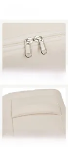 Detail of travel backpack featuring durable dual metal zippers and a padded foam handle