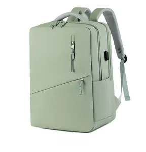 Detail view of water-resistant green laptop backpack with USB port and breathable straps