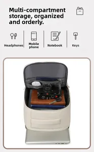 Detail of multi-compartment interior for laptop and gadgets in beige travel backpack