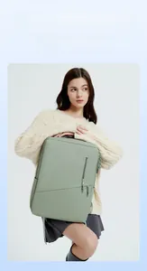 Detail view of mint green water-resistant laptop backpack with stylish diagonal zipper pocket