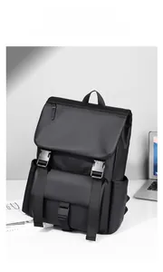 Close-up of functional buckles and waterproof matte texture on the black techwear backpack