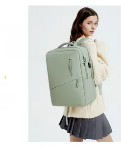 Detail of light green waterproof laptop backpack with side USB charging port for students