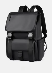 Side view of matte black waterproof backpack showing buckles and reinforced shoulder straps