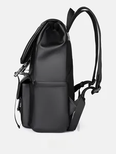 Side view of matte black waterproof backpack showing buckle pockets and mesh padding