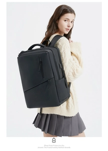 Detail of waterproof black business laptop backpack with side USB charging port