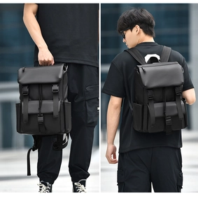 Detail of waterproof matte black backpack featuring secure buckles and padded straps