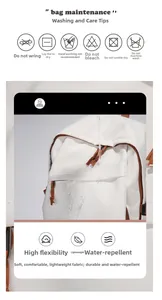 Wasserabweisender weißer Rucksack im Detail mit abperlendem Wasser auf dem Obermaterial