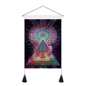 Modern mandala tapestry with geometric pyramid and purple aurora design on a wooden rod
