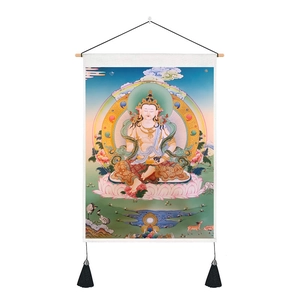Detail of Thangka scroll art with lotus deity, wooden hangers, and black silk tassels