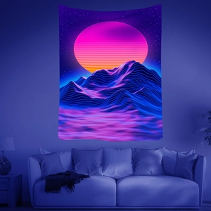Vibrant UV reactive mandala tapestry showing neon sun and grid mountains on living room wall