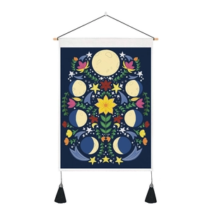 Bohemian moon phase tapestry with yellow flowers and black tassels on a dark blue background