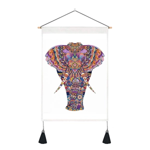 Detailed close-up of colorful mandala elephant print on white fabric with black tassels