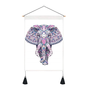Detail of colorful mandala elephant tapestry with wood hanger and black tassels