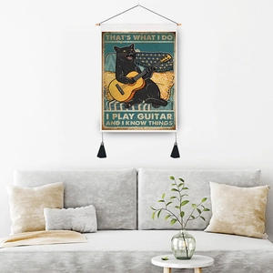 Vintage black cat playing guitar tapestry with wooden frame and black tassels on white wall