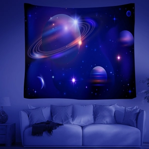 Detailed view of large galaxy tapestry with planets and stars over a sofa