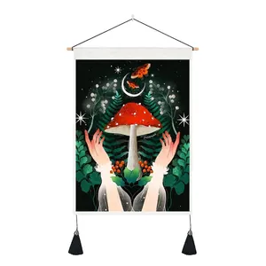 Detail of mushroom tapestry featuring wood scroll hangers and black decorative tassels