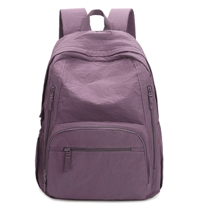 Lightweight purple nylon backpack with multiple zipper pockets for outdoor travel