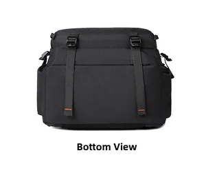 Bottom view of black outdoor backpack with orange stitching and tactical webbing straps