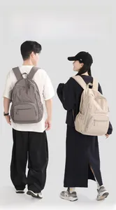Detail of lightweight breathable nylon backpack showing side pocket and durable zipper