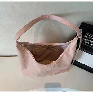Internal view of pink tote bag showing the zipper pocket and spacious main compartment