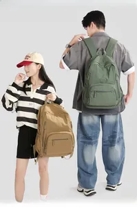 Detail of adjustable padded shoulder straps and durable nylon side mesh pockets