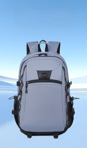 Macro detail of high-capacity outdoor backpack with grey-blue fabric and orange accents