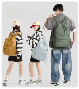 Ultralight nylon backpacks shown in yellow, blue, and green for outdoor travel