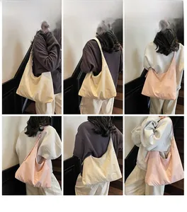 Multiple views of large capacity hobo bag in cream and pink on a model