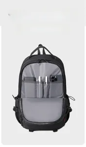 Detail of multi-compartment digital storage inside the black waterproof backpack