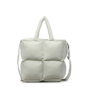 Light green quilted puff tote bag with soft padded diamond pattern and crossbody strap
