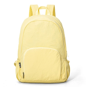 Lightweight foldable yellow nylon travel backpack with front zipper pocket and side mesh pocket