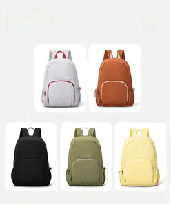 Multiple lightweight foldable backpacks in grey, orange, black, green, and yellow colors