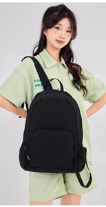 Detailed view of lightweight black foldable travel backpack with adjustable shoulder straps