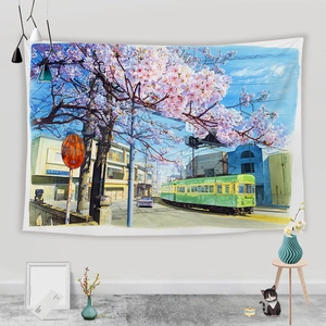 Close-up of Japanese anime tapestry showing a train and cherry blossoms on a wall