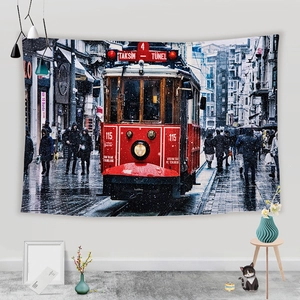 Detail of fabric tapestry featuring a vintage Istanbul red tram in a rainy street scene