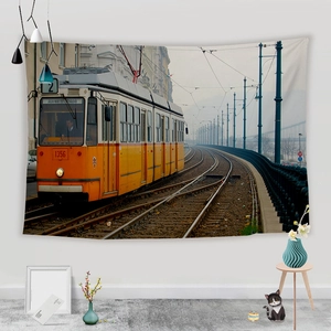 Detail of vintage Budapest yellow tram tapestry hanging on a minimalist white wall