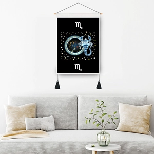 Scorpio zodiac wall tapestry with gold tassels hanging above a modern grey sofa