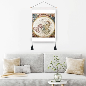 Vintage nautical world map tapestry with wooden frame hanging above a modern sofa